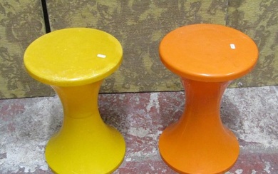 A pair of mid 20th century stools on waisted stems in orange...
