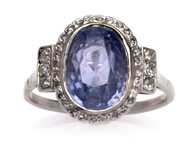 A platinum sapphire and diamond ring