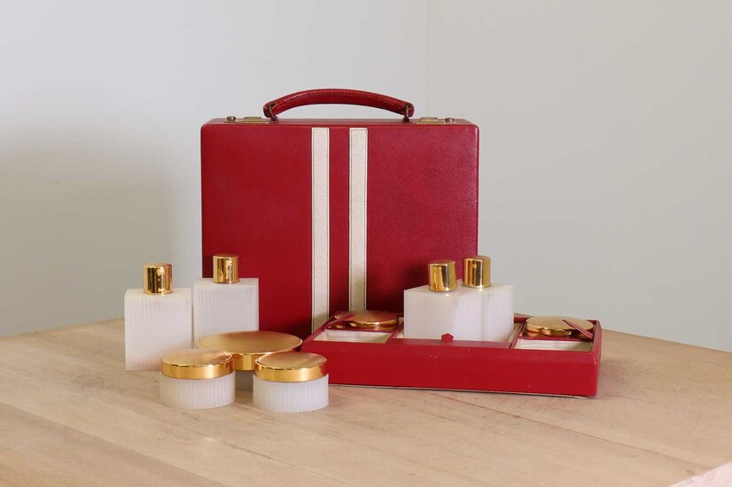 A red leather vanity case by Asprey London