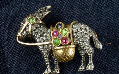 A rose-cut diamond donkey brooch, with demantoid garnet, ruby and sapphire saddle bag and harness.