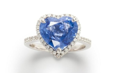 A sapphire, diamond and fourteen karat white gold ring