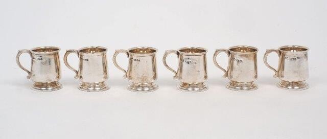 A set of six miniature silver tankards, London, 1911, Reid & Sons, 4cm high, total weight approx. 6oz (6)