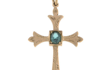 A synthetic spinel cross pendant.