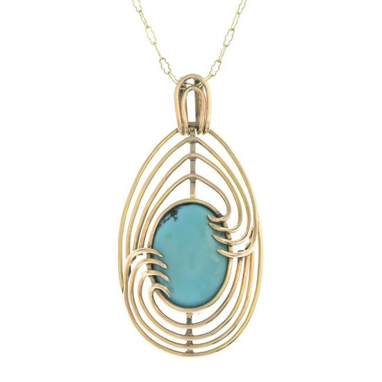 A turquoise pendant, suspended from a fancy-link