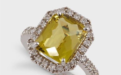 A yellow beryl, diamond, and eighteen karat white gold...