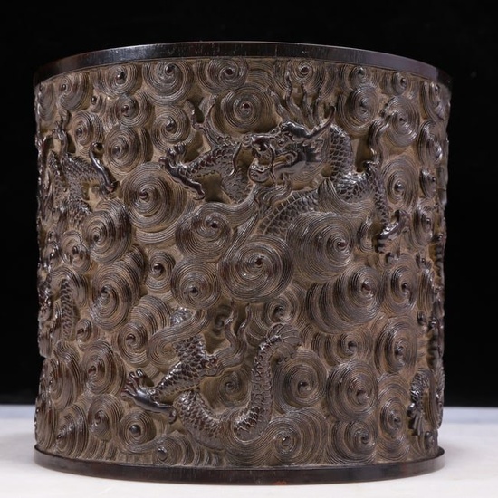A zitanwood brush pot carved with 'auspicious clouds and dragons' pattern