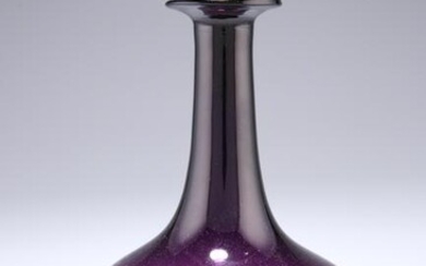AN AMETHYST GLASS DECANTER, with hammered silver metal