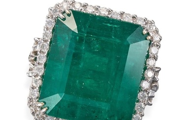 AN EMERALD AND DIAMOND RING set with an octagonal step cut emerald of 23.45 carats in a border of...