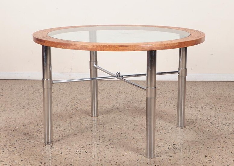AN OAK GLASS AND IRON TABLE
