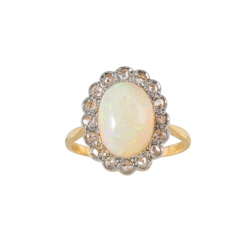 AN OPAL AND DIAMOND CLUSTER RING, the cabochon opal to a ros...