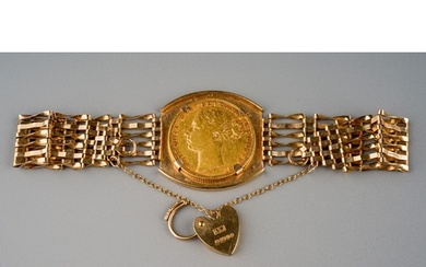 A Victorian gold full sovereign date 1873 mounted on gate-li...