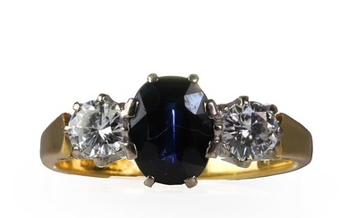 An 18ct gold diamond and sapphire three stone ring