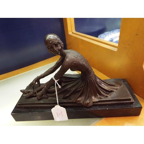 An Art Deco bronze figurine of a dancer resting on a marble ...