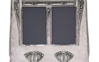 An Art Nouveau silvered pewter double photograph frame, probably German...