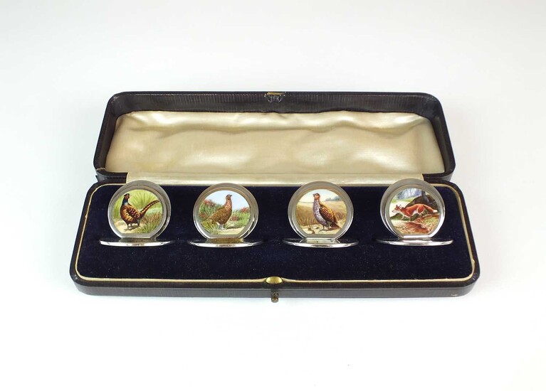 An Edwardian cased set of four silver and enamel menu holders by Sampson Mordan & Co Ltd