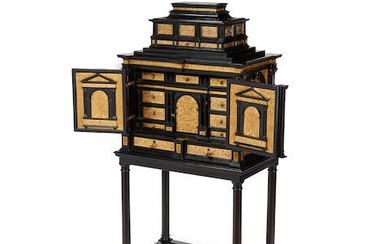 An Italian baroque style brass mounted ebonized cabinet on stand