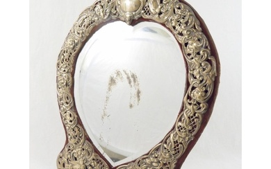 An early 20th century Continental heart-shaped bevelled edge...