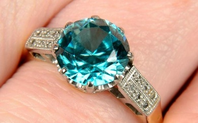An early to mid 20th century platinum and 18ct gold blue zircon ring, with single-cut diamond bar