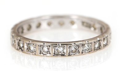 An eternity diamond ring set with numerous brilliant-cut diamonds, mounted in 14k...