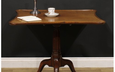 An unusual George III mahogany tripod supper table, dished i...