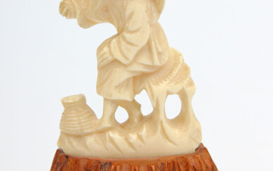Bone figurine on the wood base "Asiatic" First half of 20th century. Bone, wood. 10.7x7.1 cm