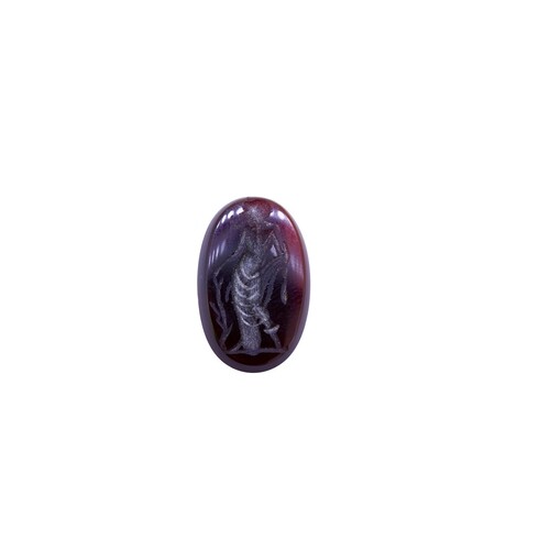 CARVED HARDSTONE INTAGLIO DEPICTING A PERSON.