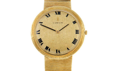 CORUM - a gentleman's 18ct yellow gold bracelet watch.
