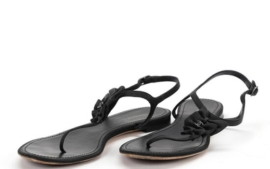 Chanel A pair of sandals of black leather with adjustable ancle strap....