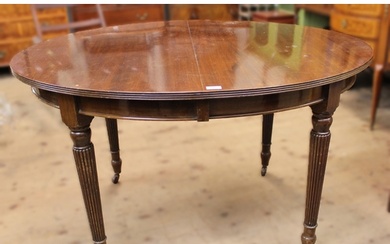 Early 20th century oval mahogany extending dining table, rai...