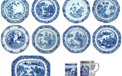 Eleven pieces of Chinese blue and white wares, 18th century, comprising two mugs each with a panel enclosing landscape scene, attached with twisted rope handle, 12.5cm and 14cm high, a large meat dish with central panel depicting pavilions within...
