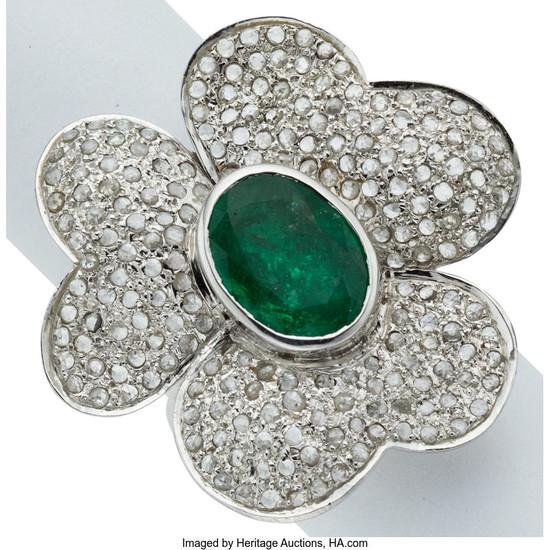 Emerald, Diamond, White Gold Ring The flower ring centers...