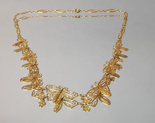 Filigree gold necklace decorated with butterflies alternating with...
