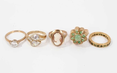 Five gold and gem-set dress rings, two with synthetic white stones in 9ct gold setting, green cabochon cluster ring in 14ct gold setting, green stone eternity ring an d a 9ct gold cameo ring