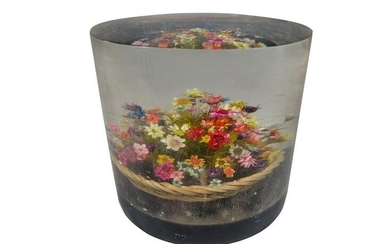 Flowers inside a lucite paperweight