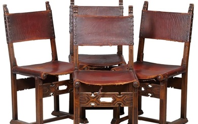 Four French Henri II Style Leather and Carved Walnut Hall Chairs, 19th c., the foliated finialed