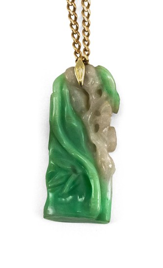 GREEN AND WHITE JADE PENDANT NECKLACE Pendant in bamboo and flower design. Includes a 14KT yellow gold chain. Length 23".