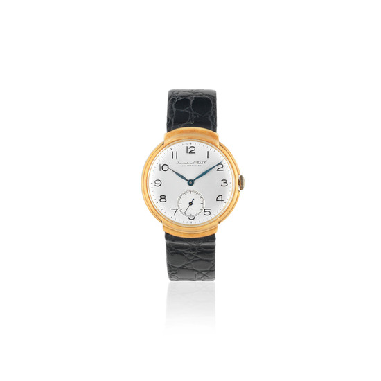 International Watch Company. An 18K gold manual wind wristwatch with hooded lugs