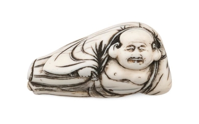 JAPANESE IVORY NETSUKE In the form of reclining Hoteh holding his treasure sack and a fly whisk. Length 2.5". Not available for inte...