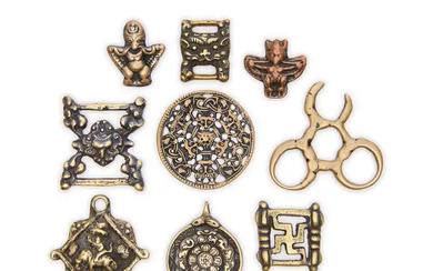 Nine Tibetan copper and copper-alloy talismans, amulets and scripture buckles, thokcha