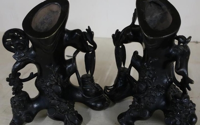 Pair of Japanese bronze stump vases, stylised in the...