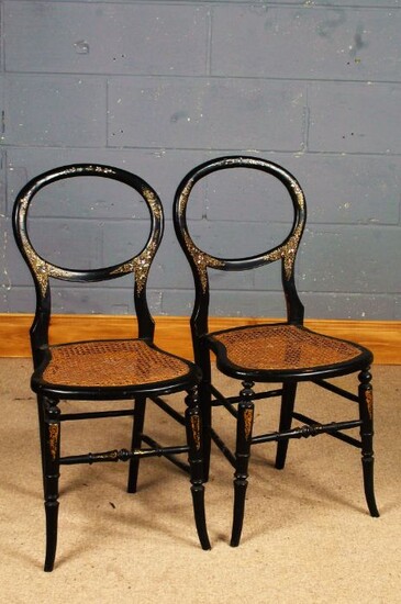 Pair of Victorian black lacquered and mother of pearl inlaid side chairs, with balloon backs and