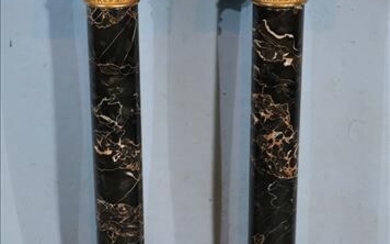 Pair of black and gold marble pedestals
