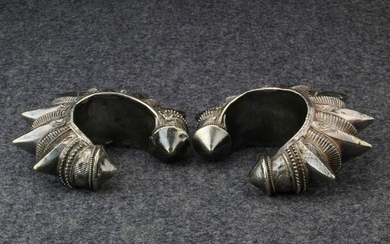 Pakistan, a pair of hollow silver woman's bracelets,...