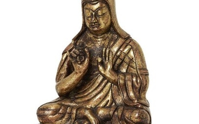 Property of a Gentleman (lots 36-85) A Tibeto-Chinese gilt copper alloy figure of Tsongkhapa, 18th/19th century, wearing a tall pandita hat and long flowing robes, seated in dhyanasana on a double-lotus base, his right hand holding a vajra, 16cm high