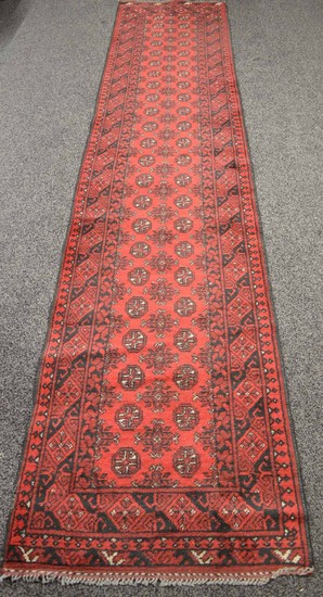 Red ground carpet runner having white and black pattern - 33...