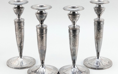SET OF FOUR WEIGHTED STERLING SILVER CANDLESTICKS