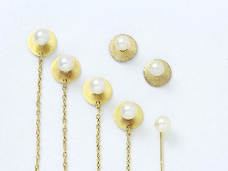 Set in 750 thousandths gold and cultured pearls,...