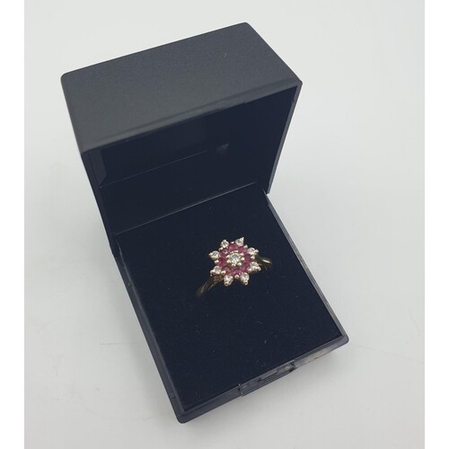 Stone set 18ct gold ring with diamonds and rubies. Mounted a...