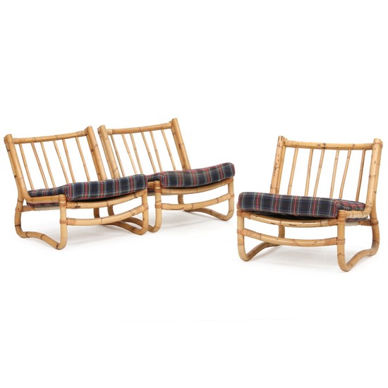 Swedish furniture design: Set of three easy chairs of bamboo. Cushions upholstered with checkered wool. (3)