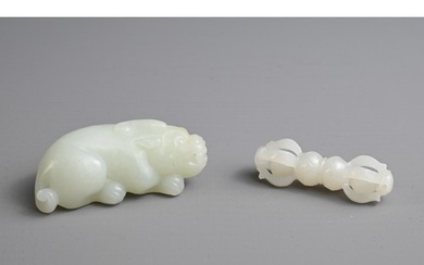 TWO CHINESE CARVED JADE ITEMS. To include a pale celadon pen...